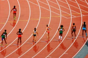 Runners in stadium
