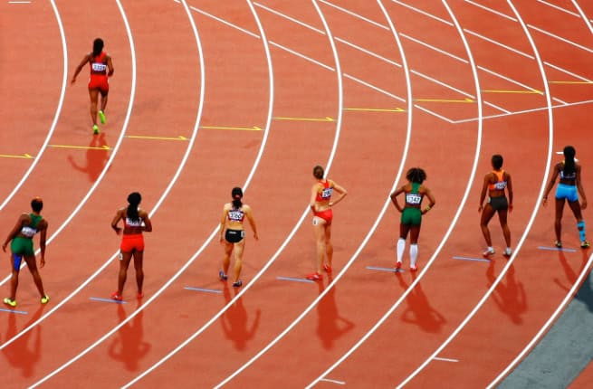 Runners in stadium