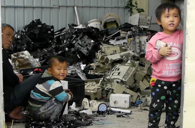 chinese children playing in e-waste