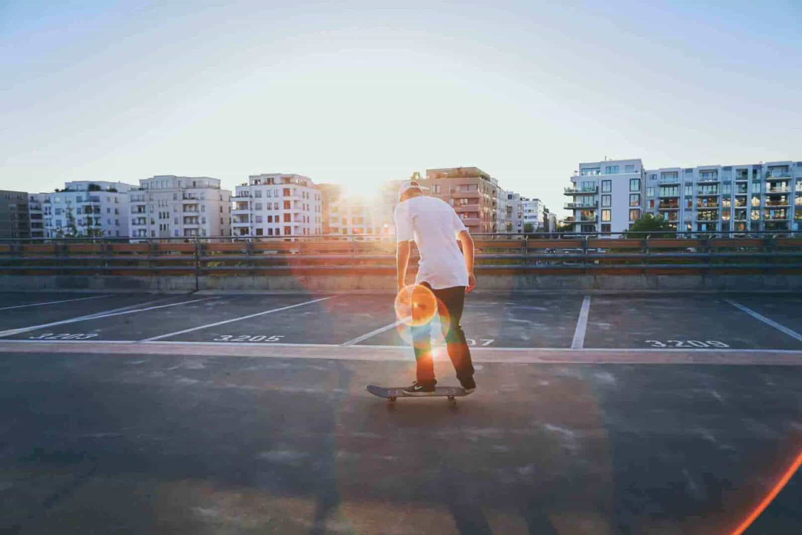 Skater on parking deck at sunset