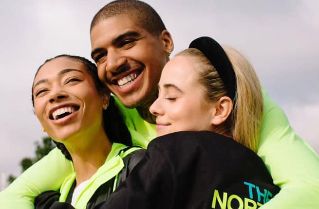 Man hugging two women