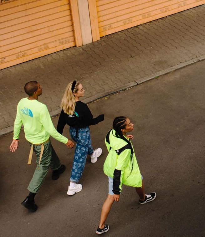 young people in neon wear on street
