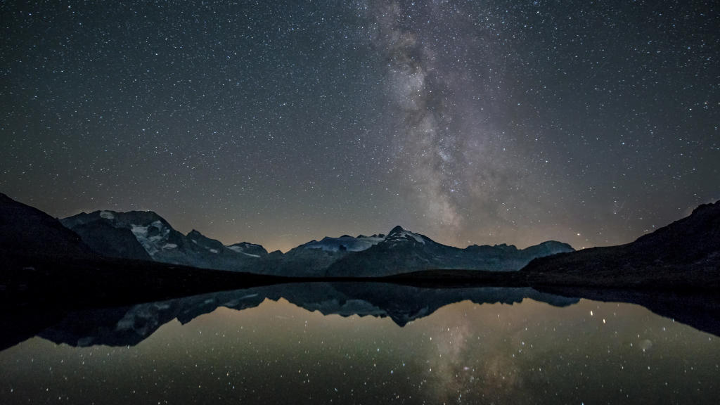 Alpine lake location at night