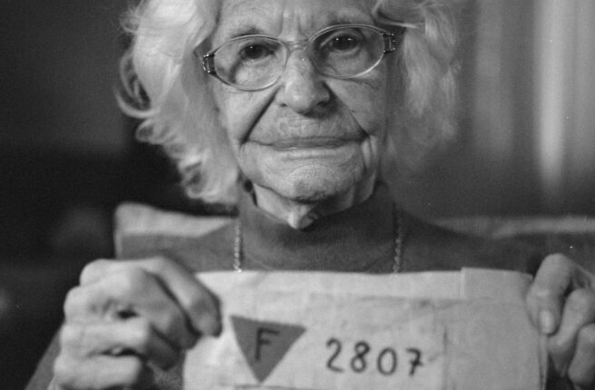 women holding up her KZ number
