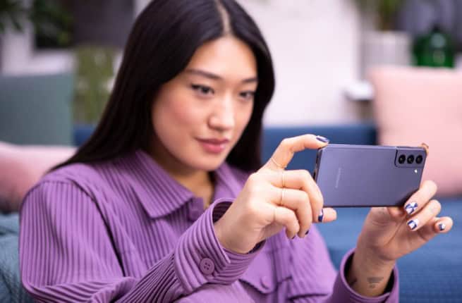 Peggy Gou looking on her phone