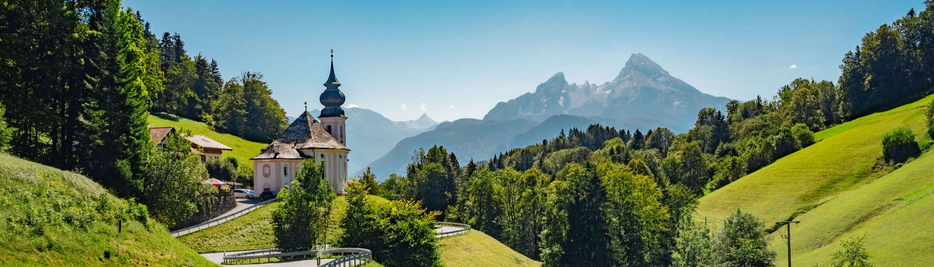 church with street and mountains