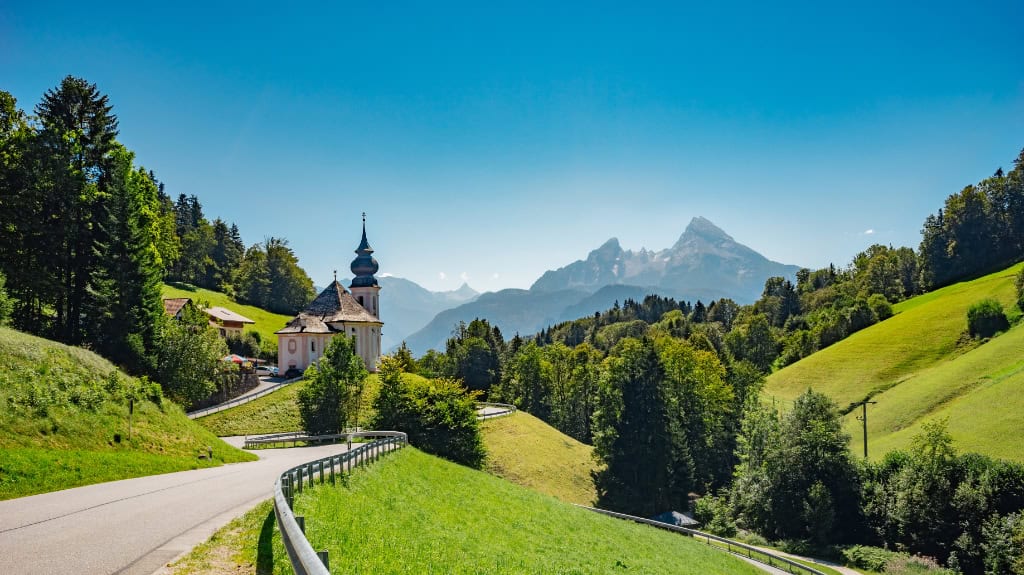 church with street and mountains