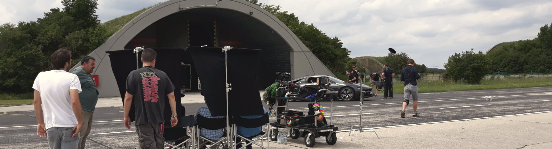 film crew with car on runway